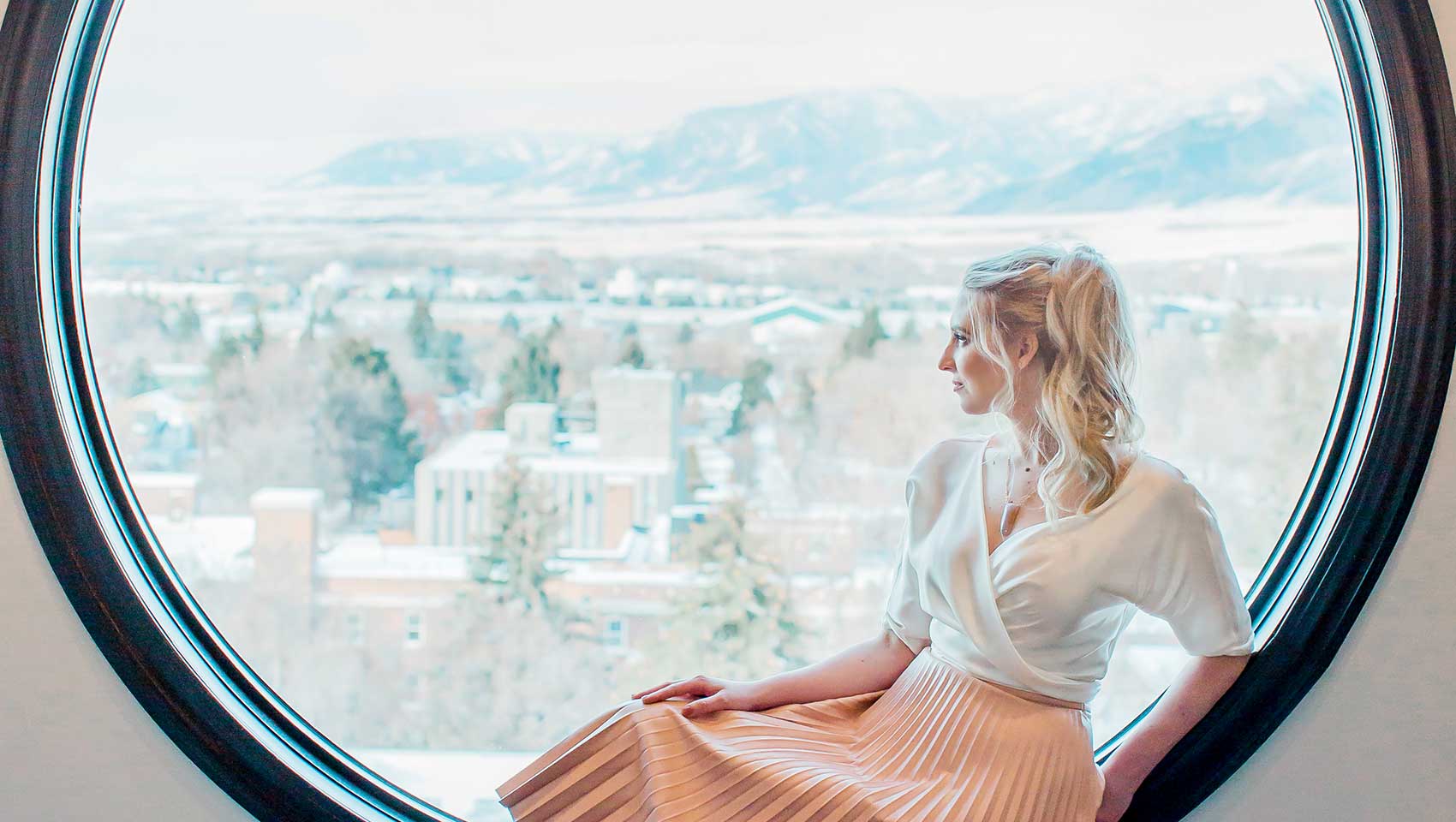 woman sitting by window