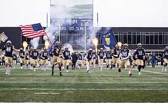 msu bobcat football team with American flag